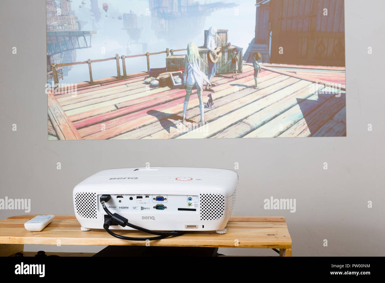 BenQ W1210ST projector playing Gravity Rush 2 on PlayStation 4. Stock Photo