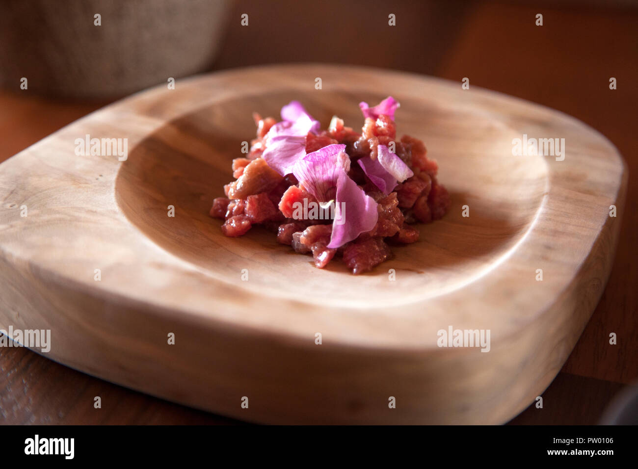 Lamb tartar at Mil Moray, the restaurant and research lab from Peruvian chef Virgilio Martinez of Central, overlooking the Inca terraces of Moray. Stock Photo