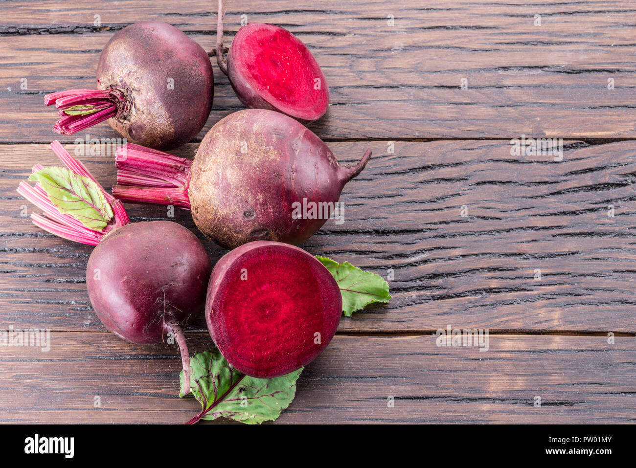 Red beets or beetroots on the wooden table. Stock Photo
