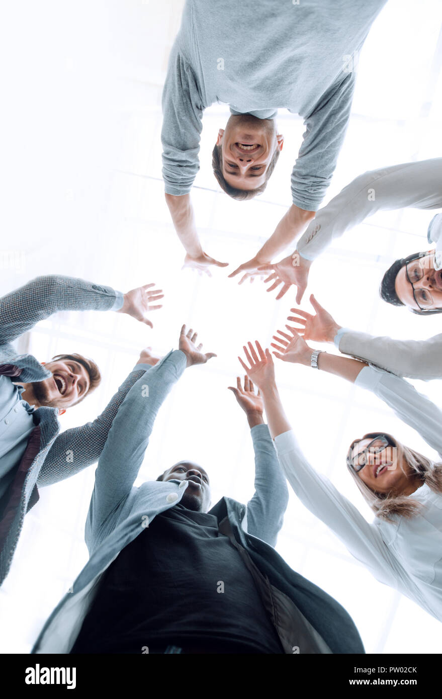 smiling business team standing in a circle Stock Photo - Alamy
