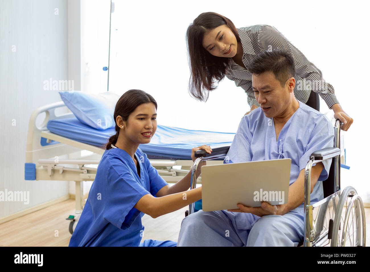 Physical therapist explain treatment method to senior patient and