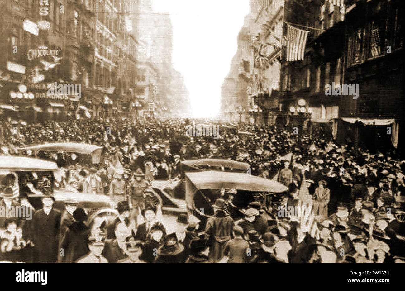 Armistice Day -   Crowds celebrate the end of WWI in the streets of New York,USA  (from a postcard of the time) Stock Photo