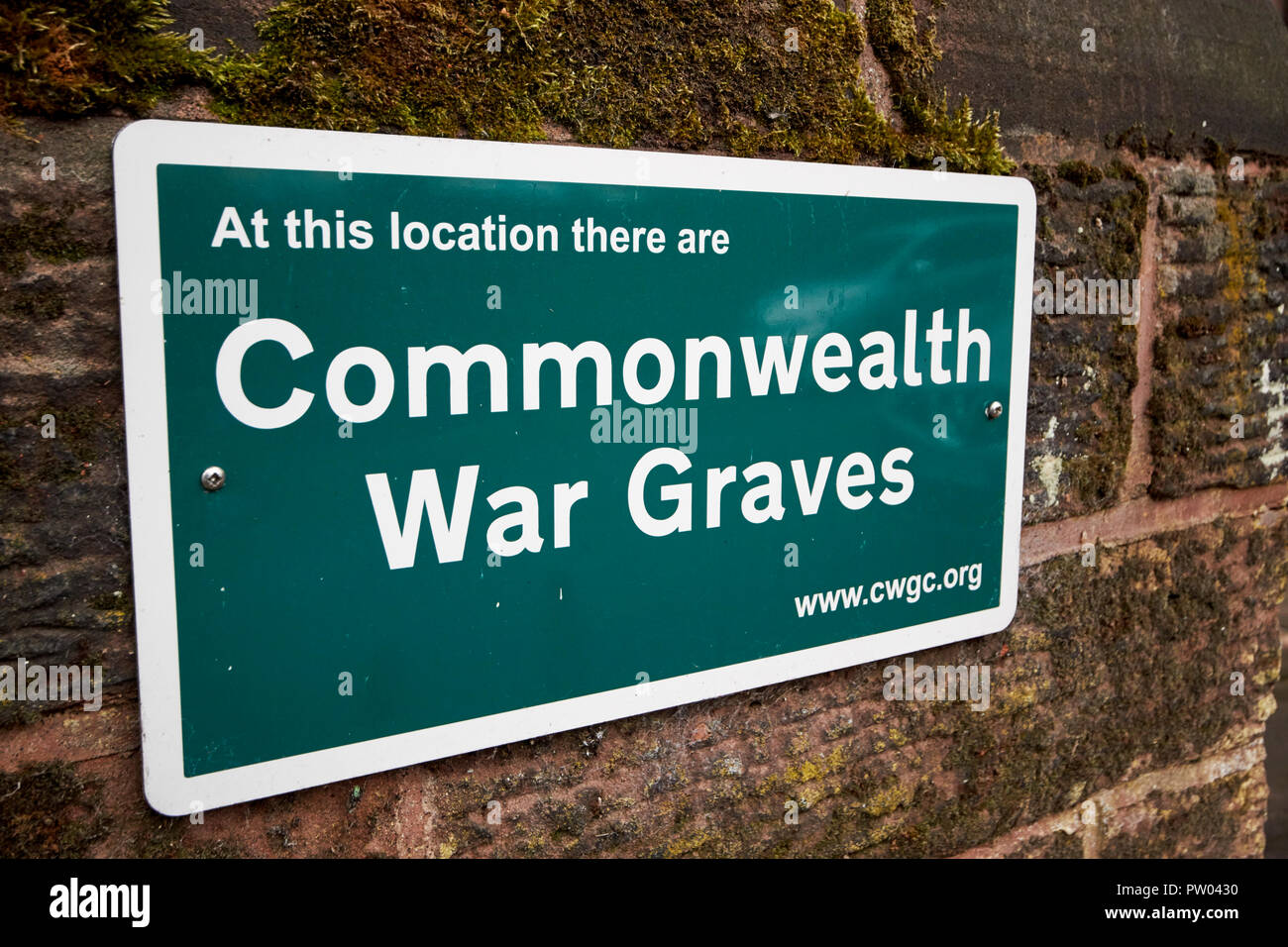 commonwealth war graves sign outside St Peters Church in Woolton Liverpool Merseyside England UK Stock Photo