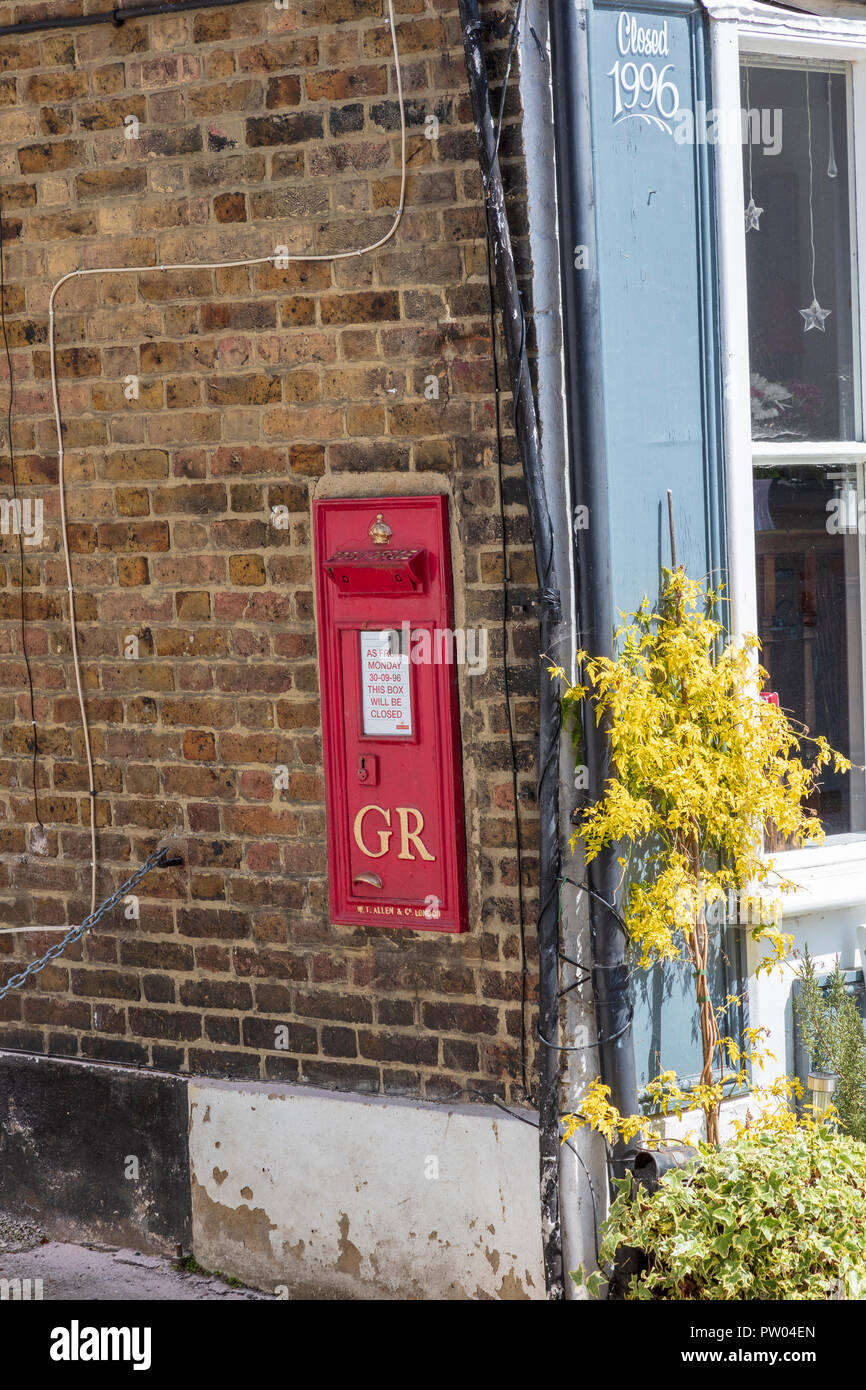 Closed down Post Office and Post Box, closed in 1996, Upnor High Street, Kent, UK Stock Photo
