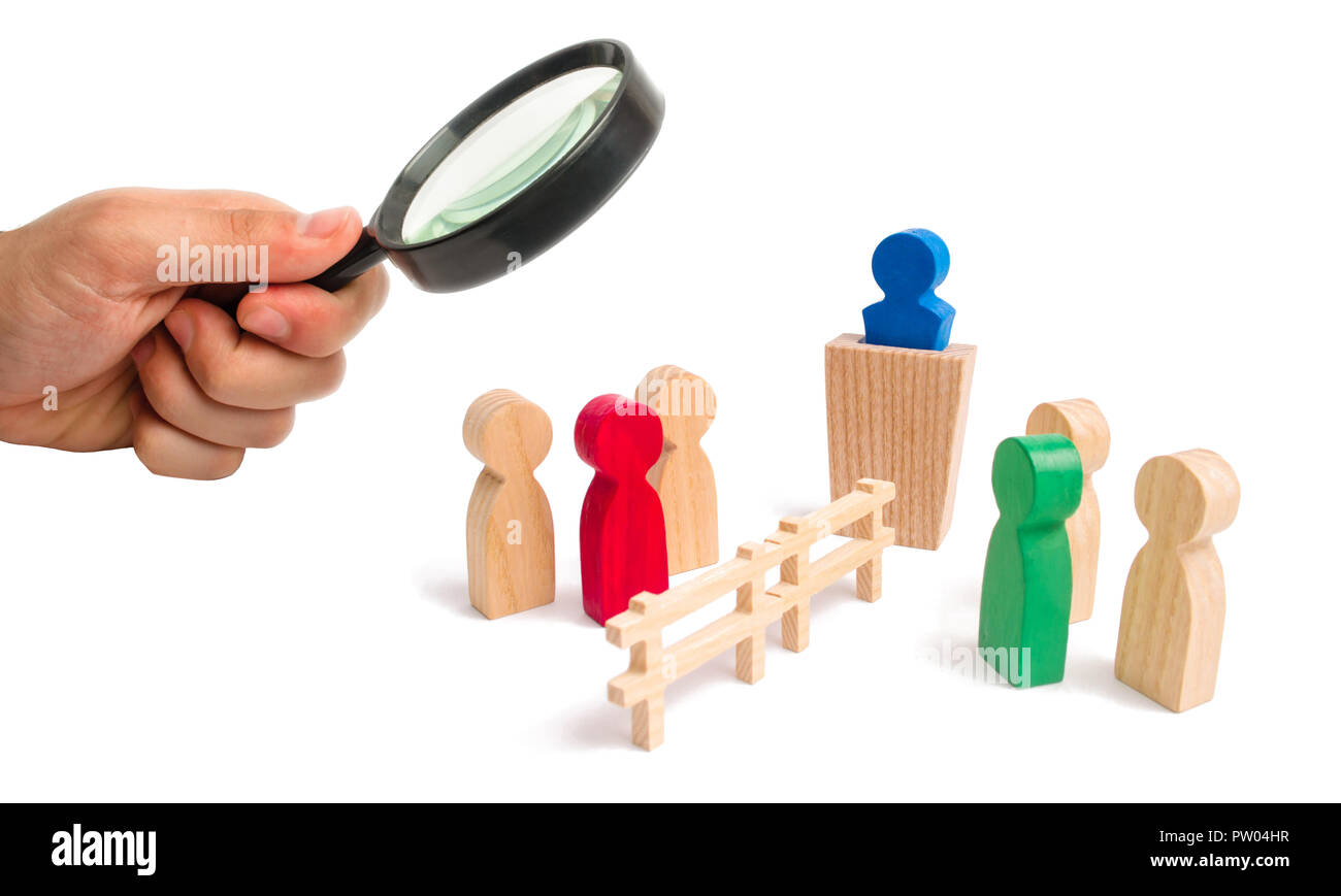 Magnifying glass is looking at the wooden fence divides the two groups discussing the case. Termination and breakdown of relations, breaking ties. Con Stock Photo