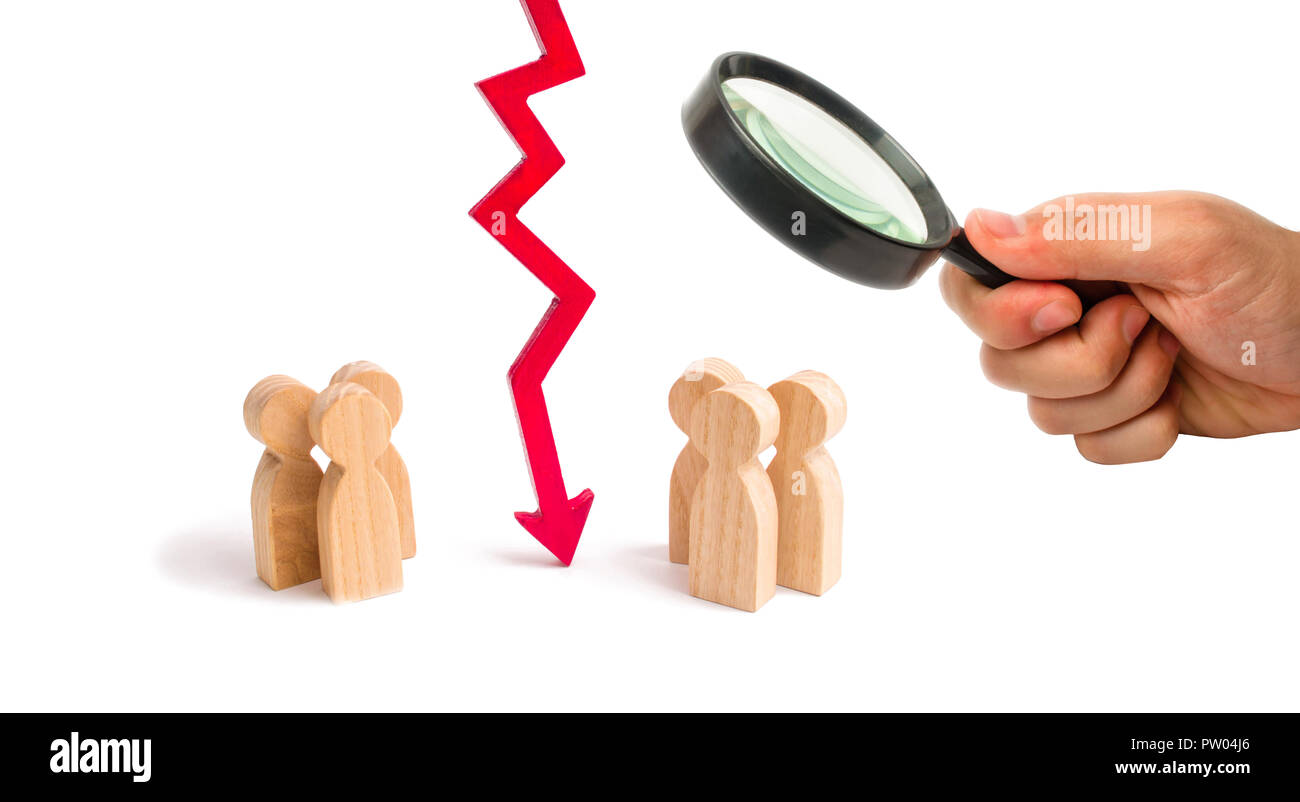 Magnifying glass is looking at the wooden red chart arrow down divides the two groups discussing the case. breaking ties. Contract break, conflict of  Stock Photo
