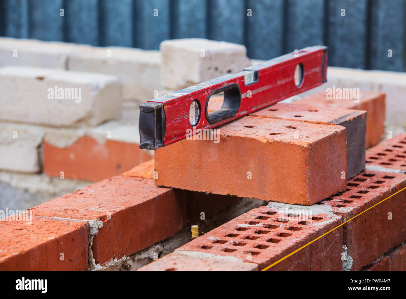 construction of  brick building building level on bricks Stock Photo