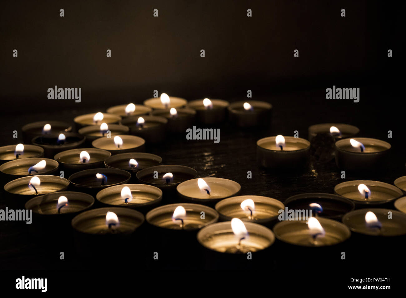 Symbols of Islam. Candle lights on black background. Abstract isolated