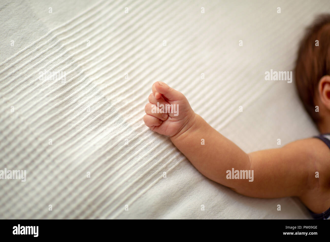 New born baby boy hand happiness and childhood concept Stock Photo