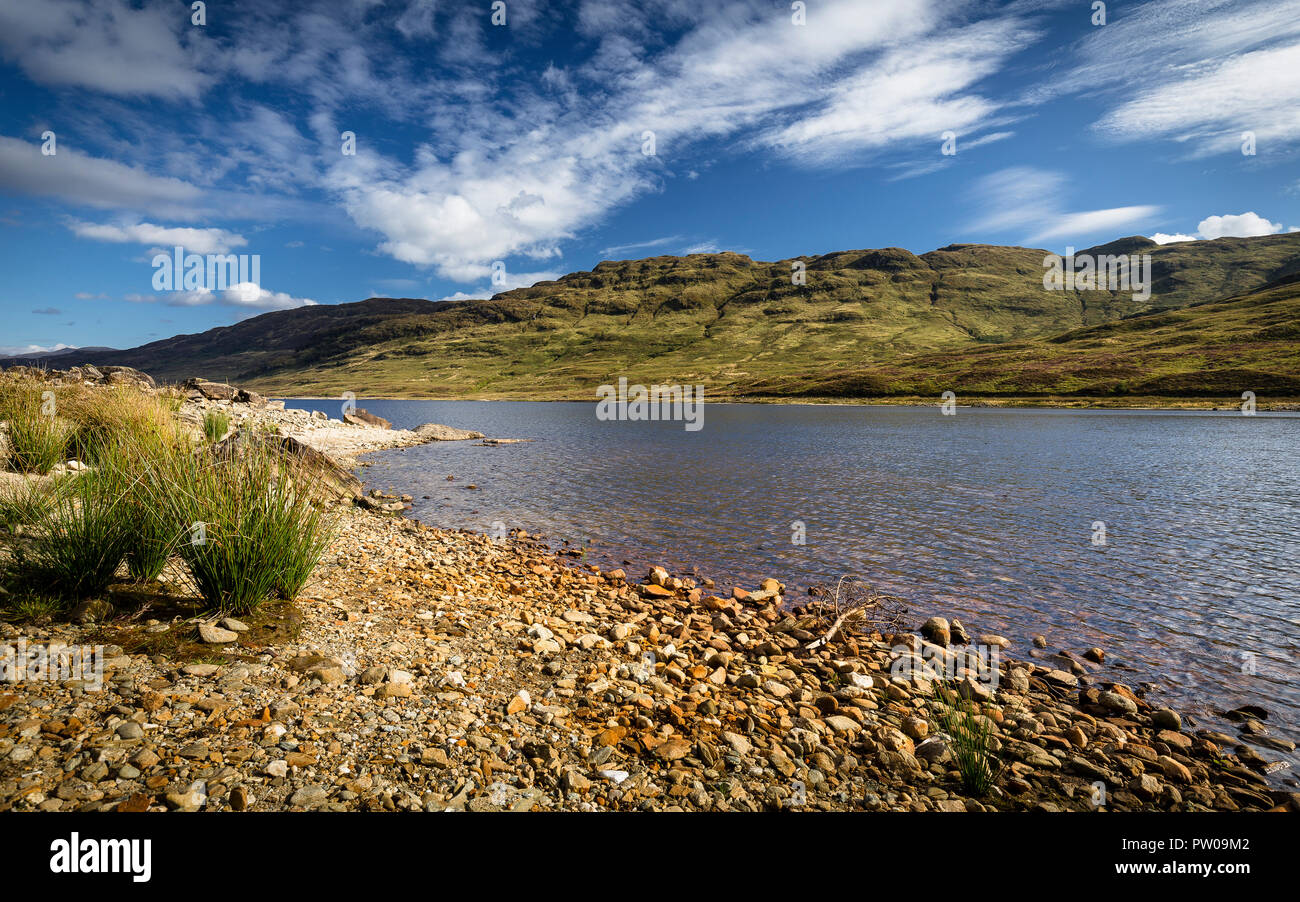 Loch in Scottish highlands on beautiful summer afternoon, Scotland Stock Photo