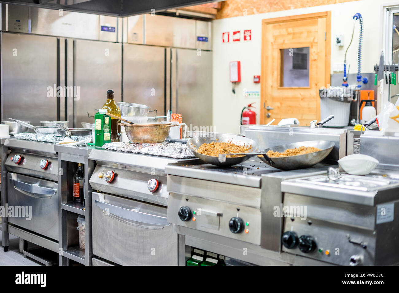 Kitchen's interior while preparing food during lunch time in the restaurant Stock Photo