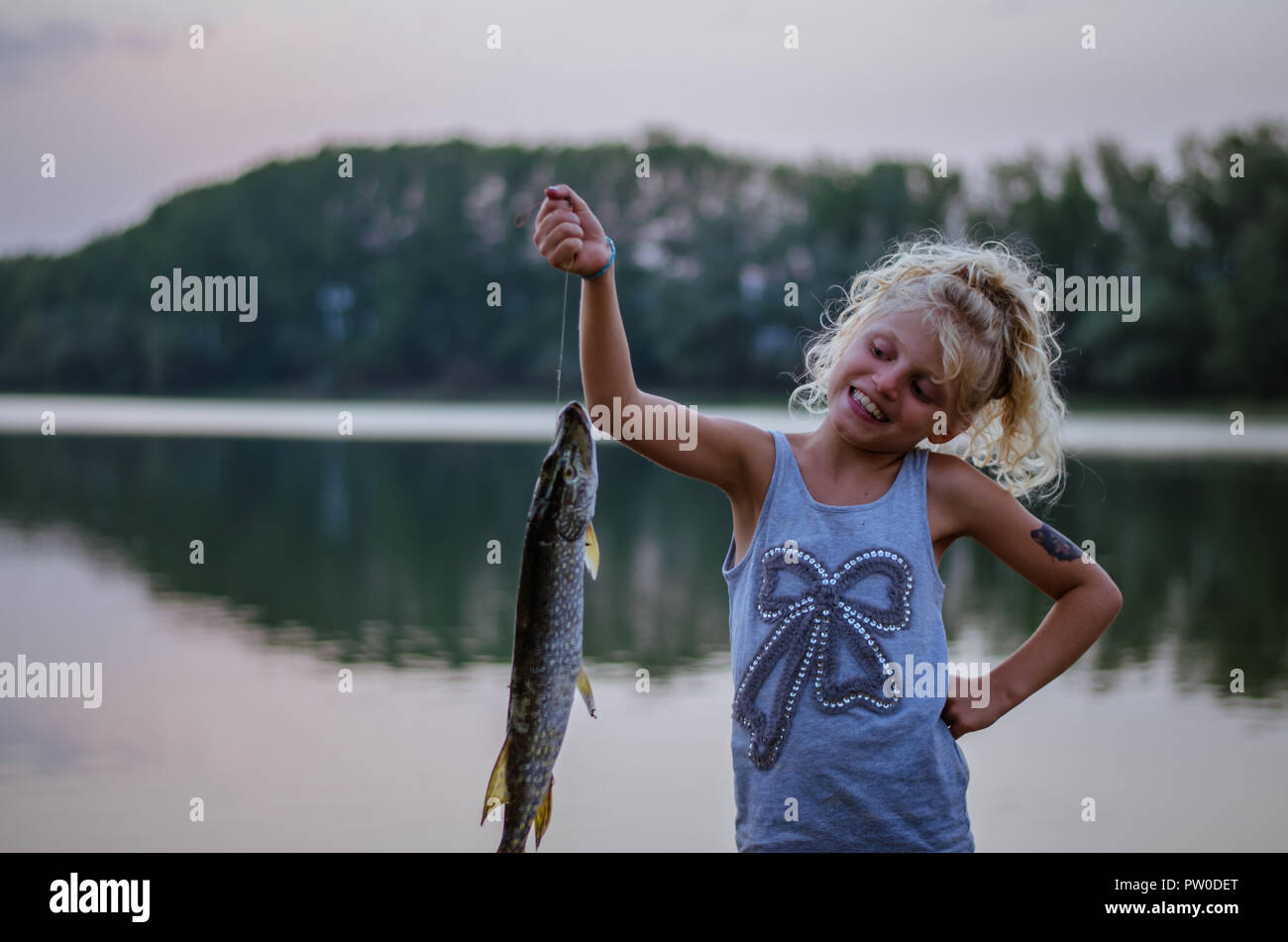 Child fish hi-res stock photography and images - Page 2 - Alamy