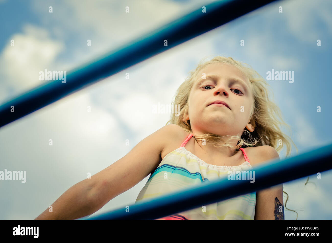 adorable little girl with blond hair portrait and blue sky Stock Photo ...