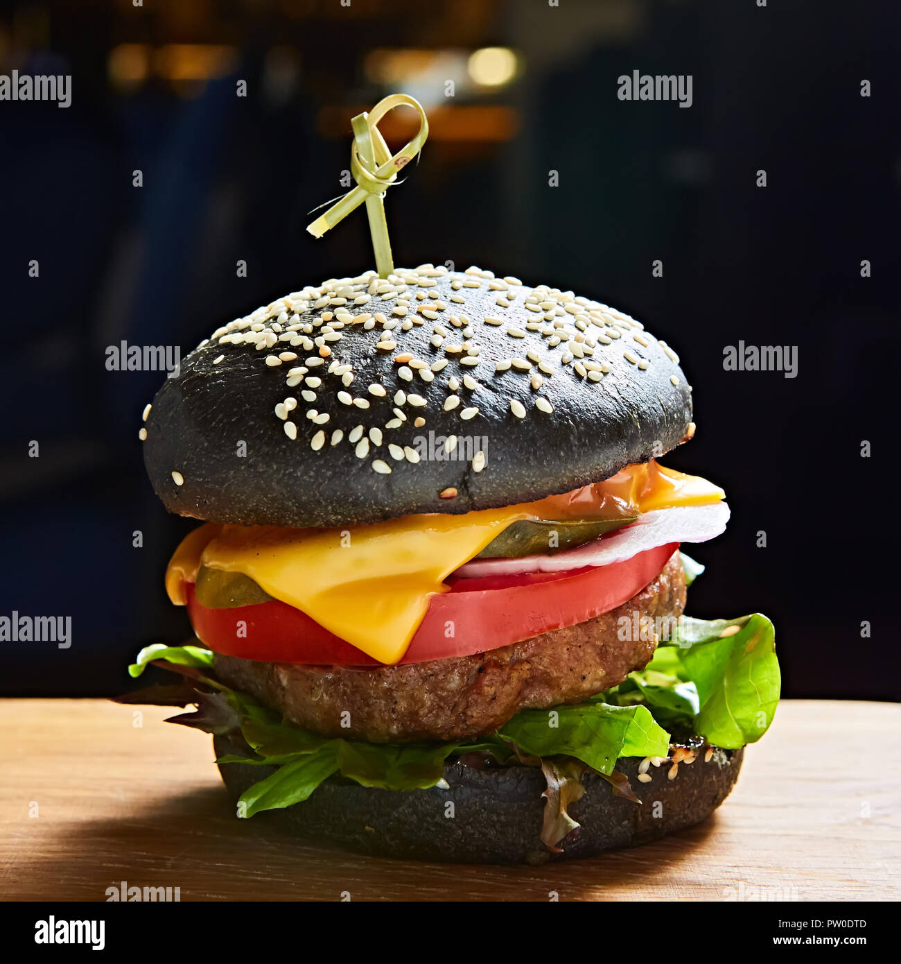 Japanese Black Burger with Cheese. Cheeseburger from Japan with black