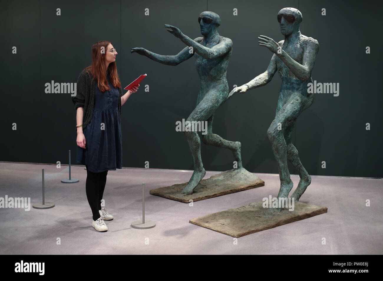 A Visitor Looks At The Work Of Elisabeth Frink On Display At - 