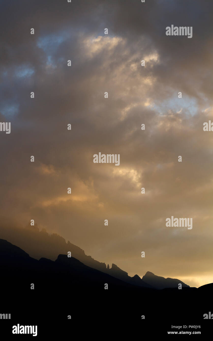 Sunset over the Dragon's back section of the Drakensberg Mountains in South Africa Stock Photo