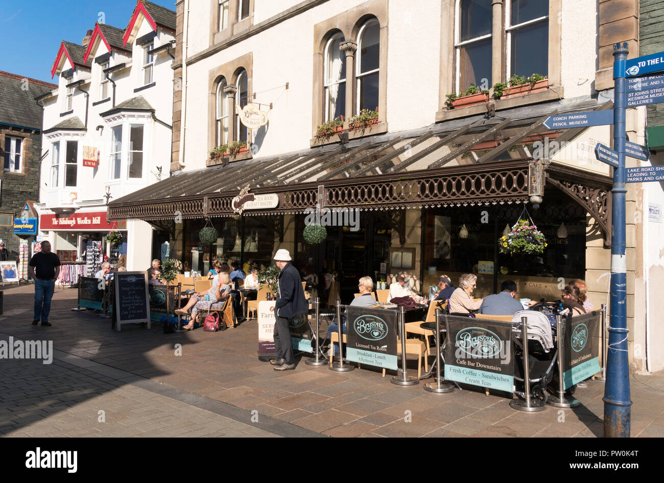 People sitting outside Brysons Tea Room in Keswick town centre, Cumbria