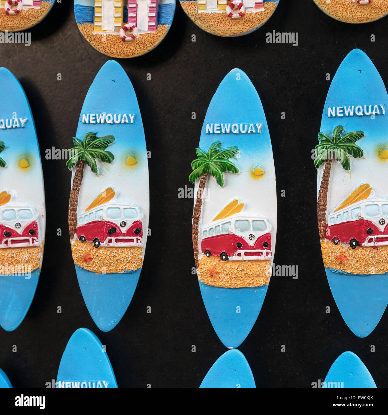 Small surfboard fridge magnet souvenirs on sale at a Newquay souvenir shop - home of Boardmasters Festival. Stock Photo