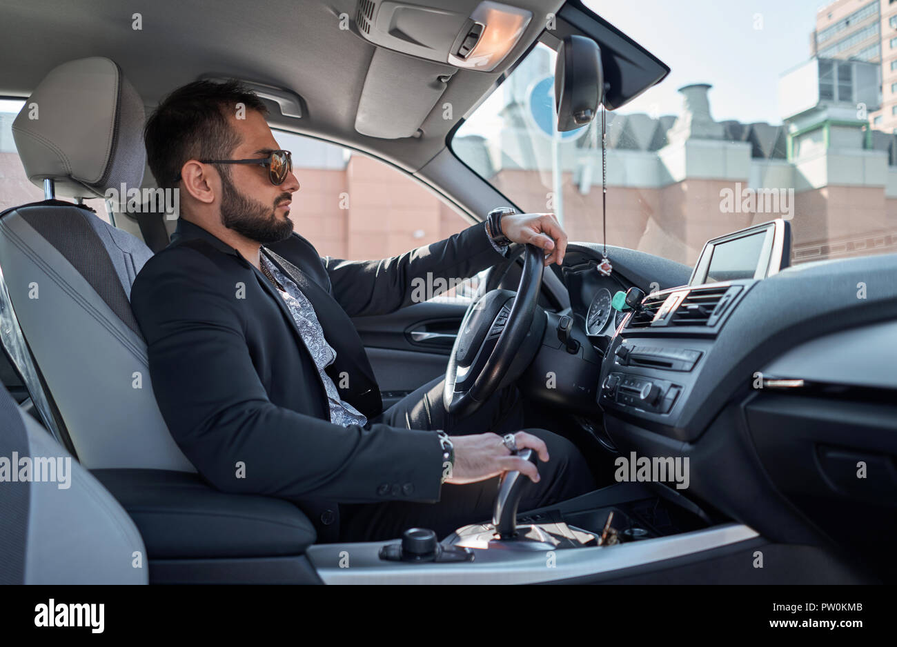 man in a jacket out of the car Stock Photo - Alamy