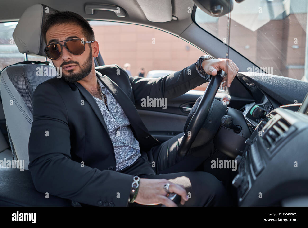 man in a jacket out of the car Stock Photo - Alamy