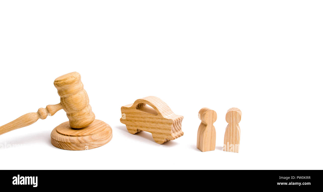 Wooden figurine of a car with people in a hammer of the judge on a white background. Minimalism. Purchase and sale of the car. The trial, confiscation Stock Photo