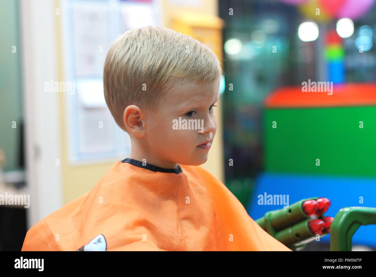 Haircut Of A Little Boy In A Children S Hairdressing Salon Stock