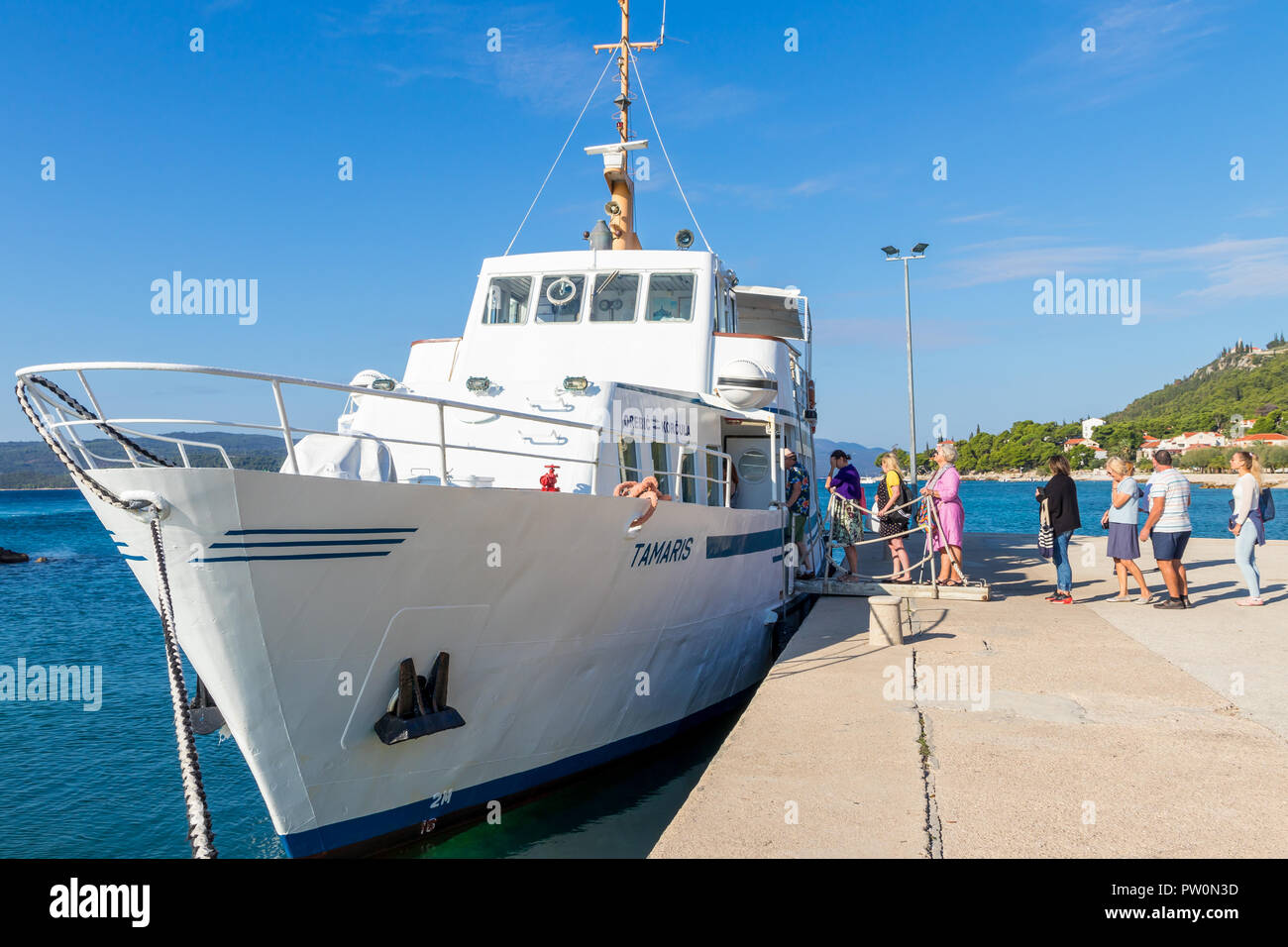 Passengers queuing up to enter the ferry which connects Orebić and Korčula Town, Orebić, Croatia, Europe Stock Photo