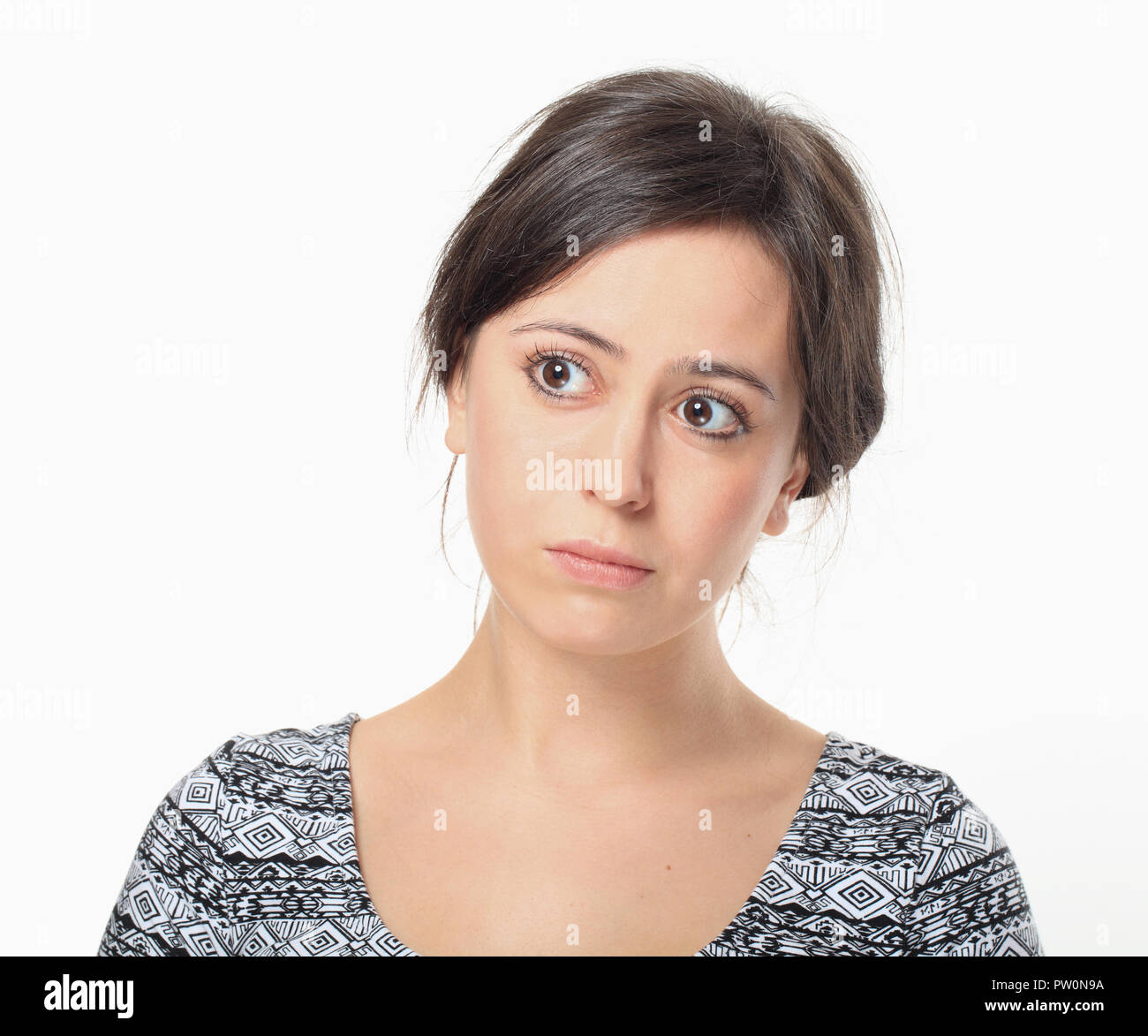 Upset young woman looking right Stock Photo
