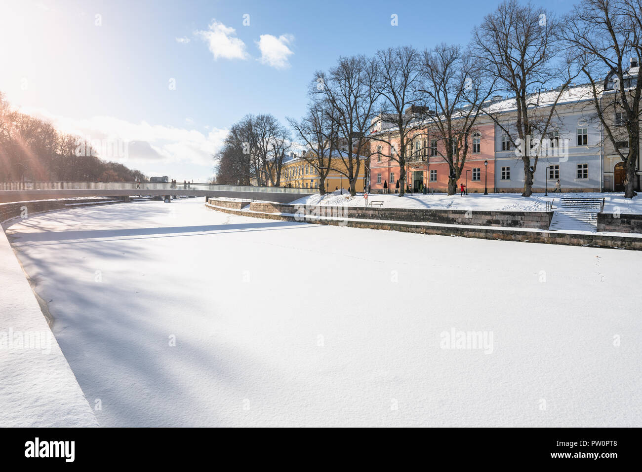 Colorful buildings by the shore of Aurajoki river at sunny winter day Stock Photo