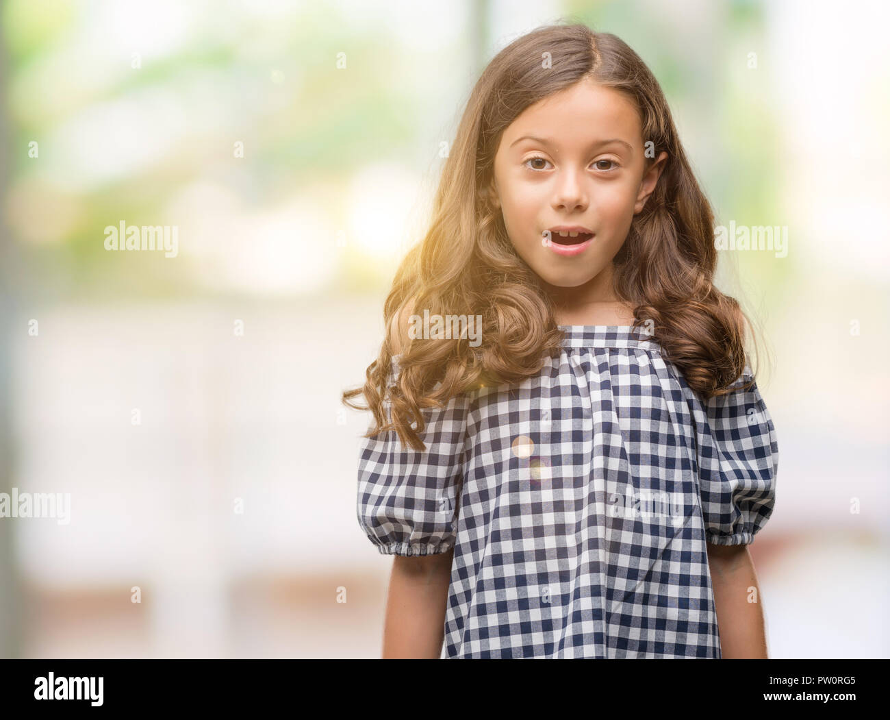 Brunette Hispanic Girl Wearing Black And White Dress Scared In