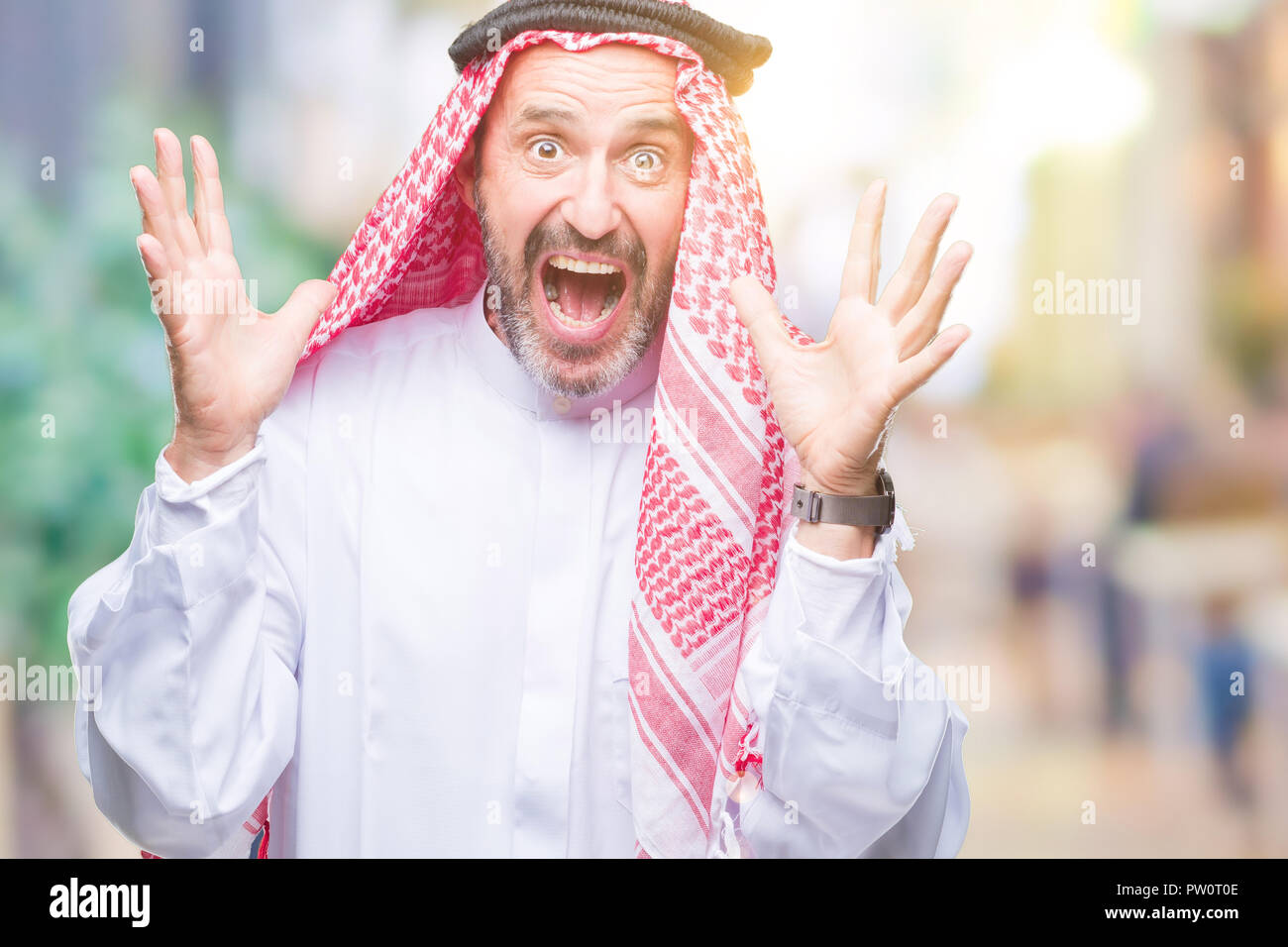 Senior Arab Man Wearing Keffiyeh Over Isolated Background Celebrating Crazy And Amazed For