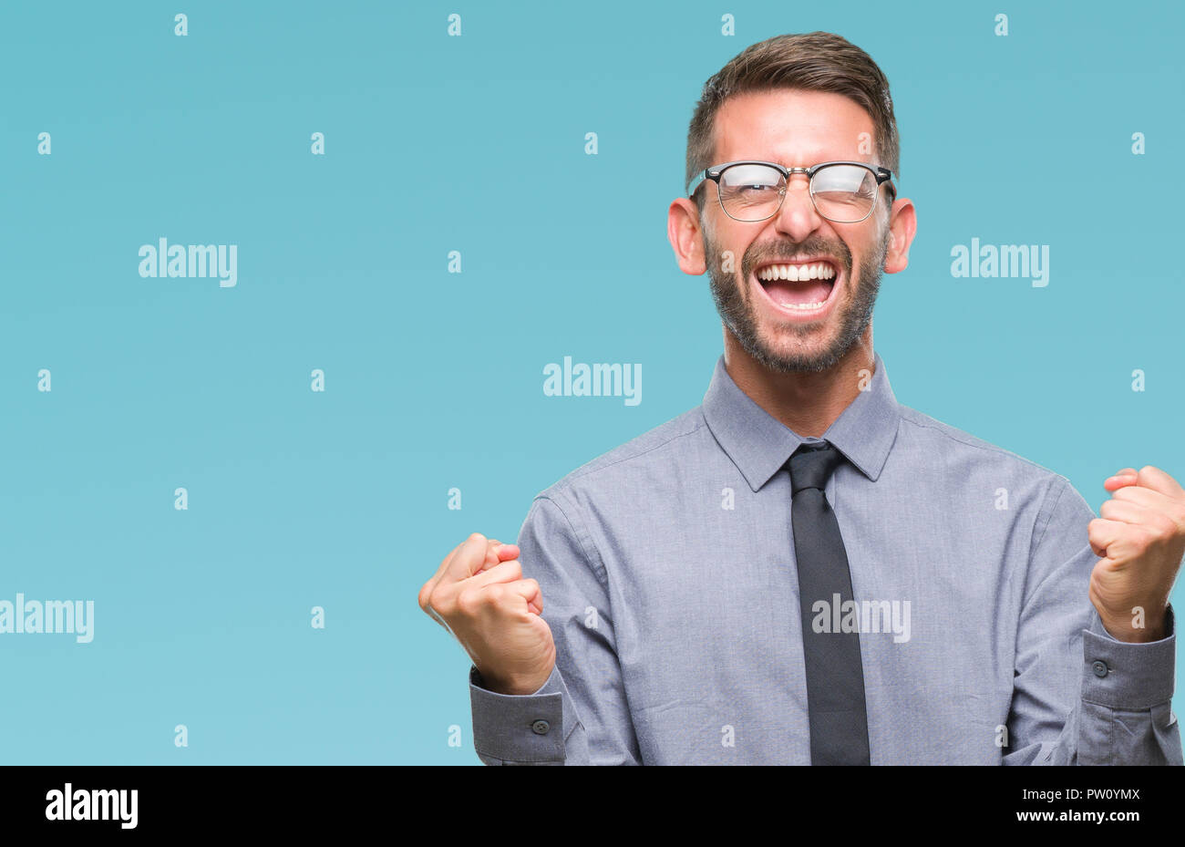 Young handsome business man over isolated background very happy and ...