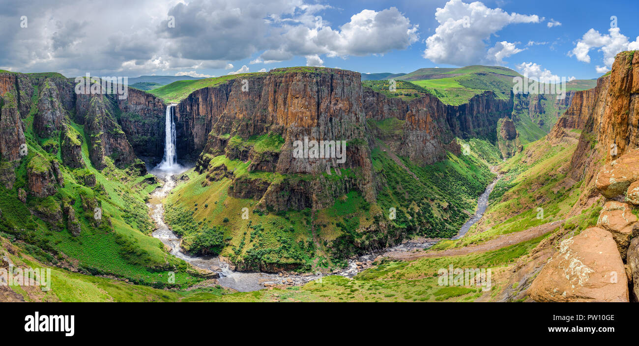Maletsunyane Falls in Lesotho Africa. Most beautiful waterfall in the world. Green scenic landscape of amazing water fall dropping into a river inside Stock Photo