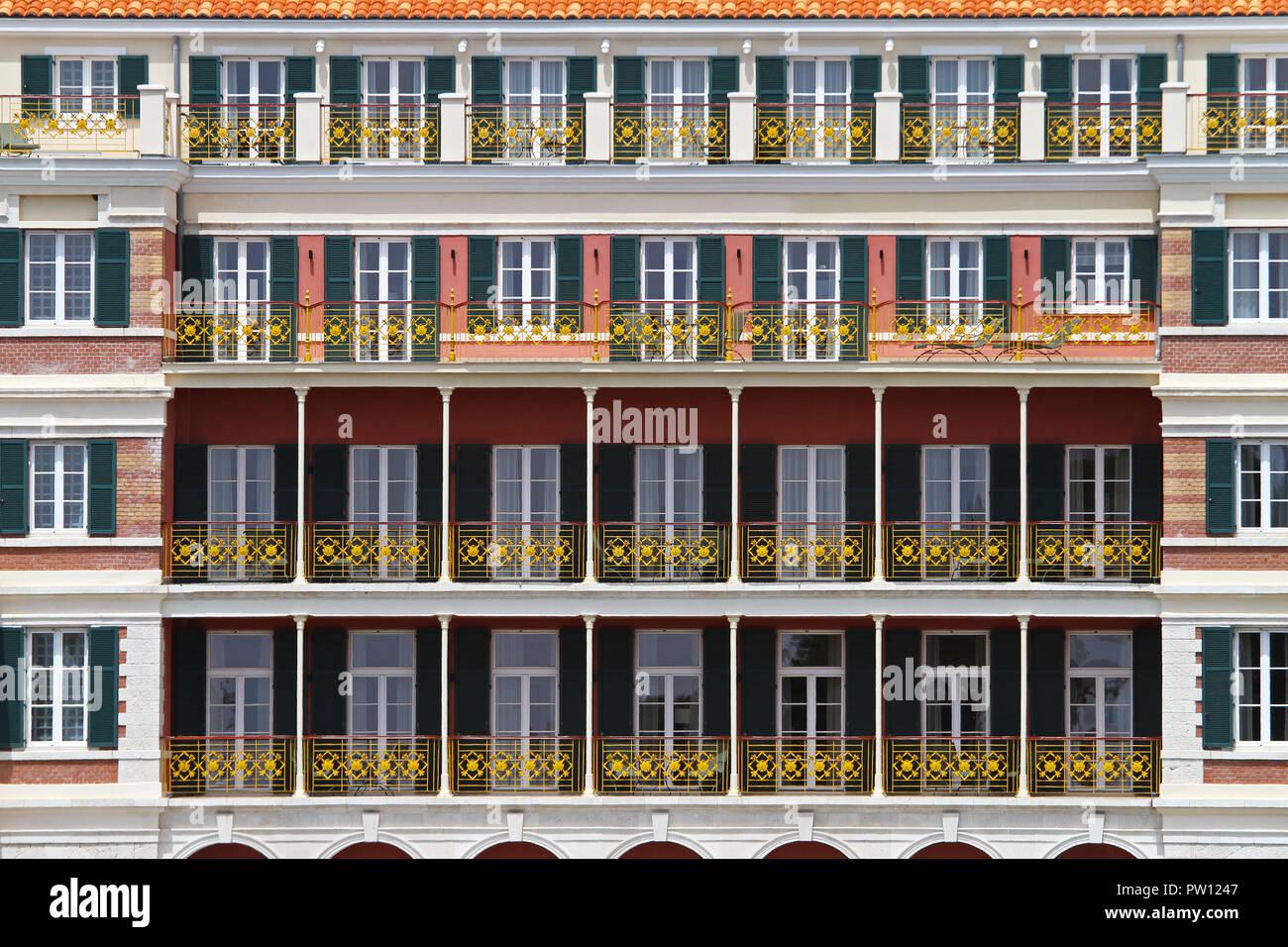 Colonial style balconies facade at old hotel Stock Photo - Alamy