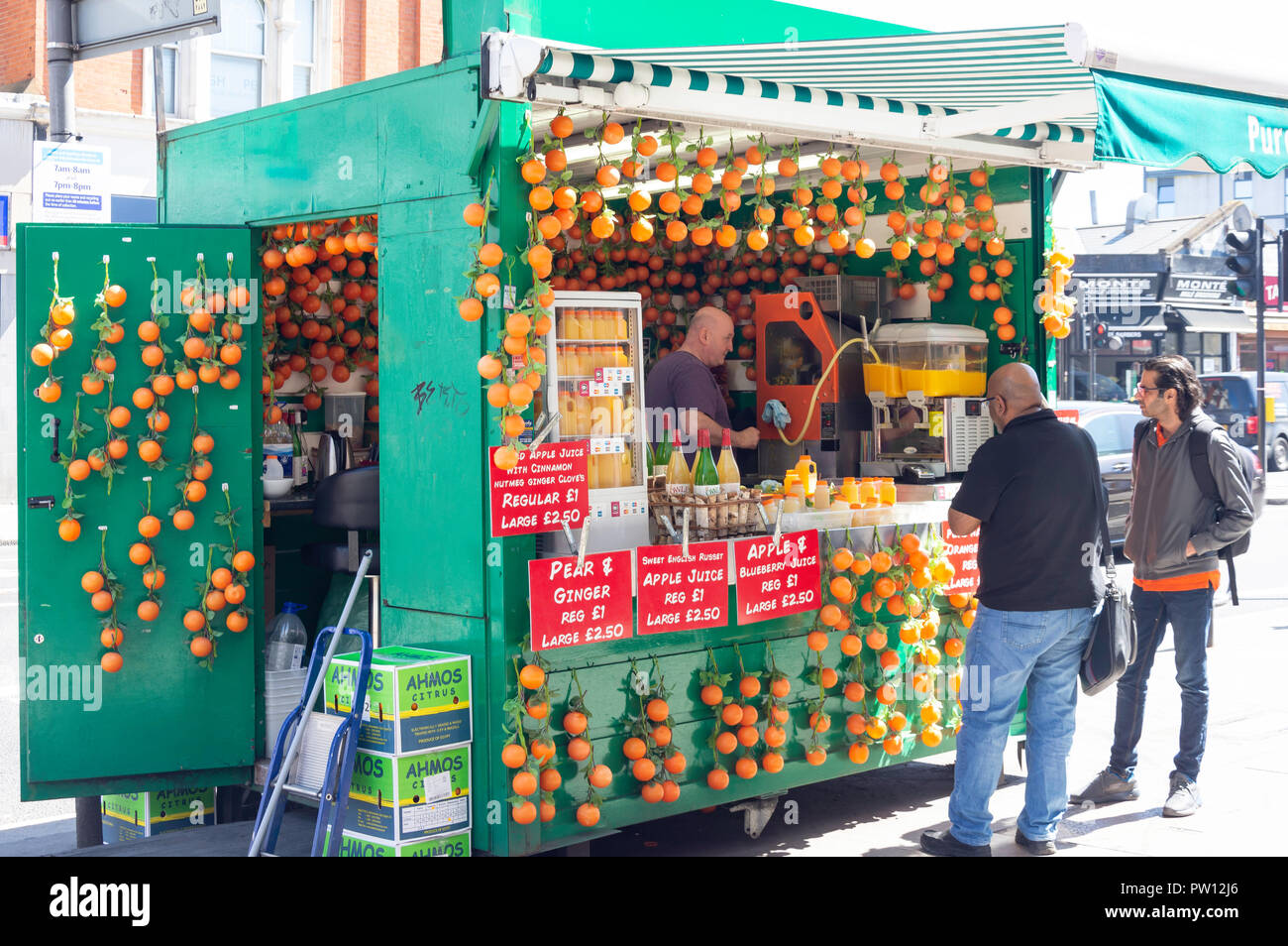 Fruit juice street kiosk, Kilburn High Road, Kilburn, London Borough of Camden, Greater London, England, United Kingdom Stock Photo