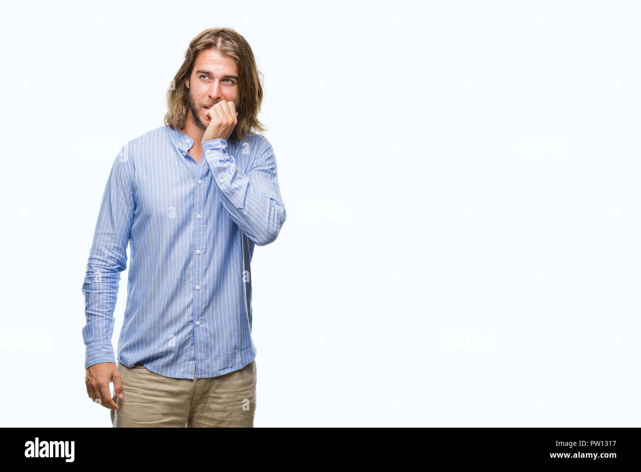 Young handsome man with long hair over isolated background looking stressed and nervous with hands on mouth biting nails. Anxiety problem. Stock Photo