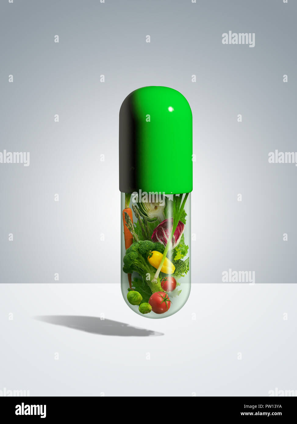 Concept A Green Pill Filled with Vegetables, Healthy Eating, Nutritional, Eat your Vegetable, Prescription Diet, Food Group Stock Photo