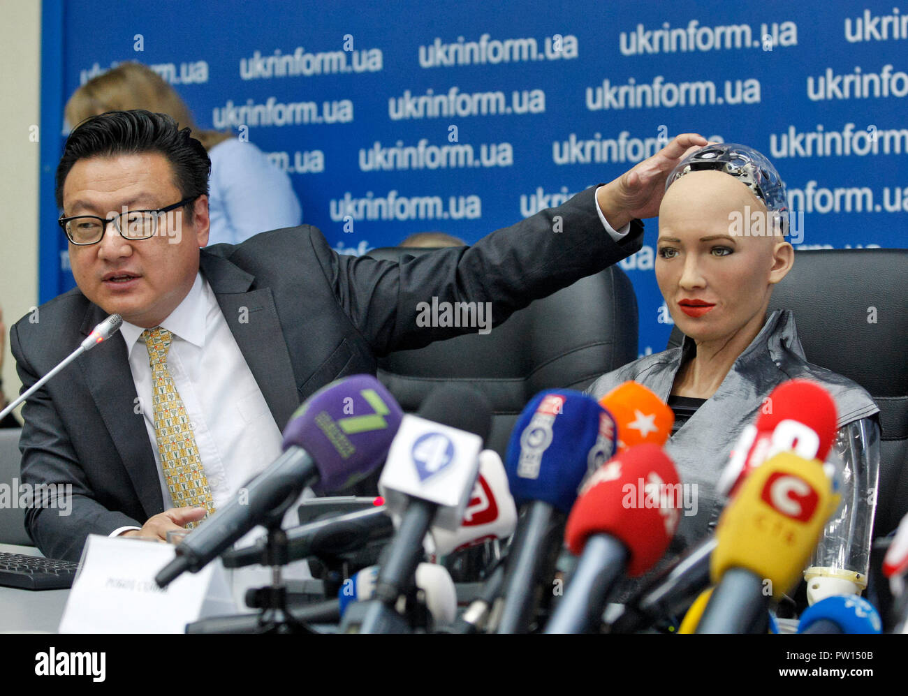 The humanoid robot Sophia (R) and the Sophia's creator and Director and  Chief Financial Officer of Hanson Robotics David Chen (L) seen take part a  press conference in Kiev. The robot Sophia