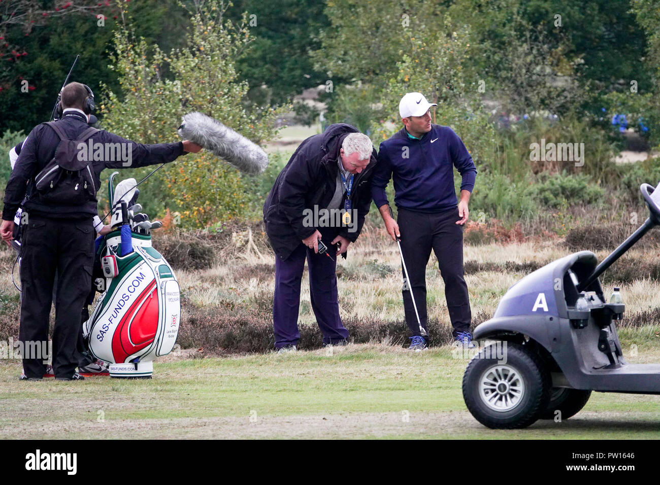 Walton Heath Golf Club,  11th October, 2018.   Francesco molinari gets a 'ruling' from European tour ref, Andy McFee, at  the SkySports British Masters golf championship hosted by Justin Rose Credit: Motofoto/Alamy Live News Stock Photo