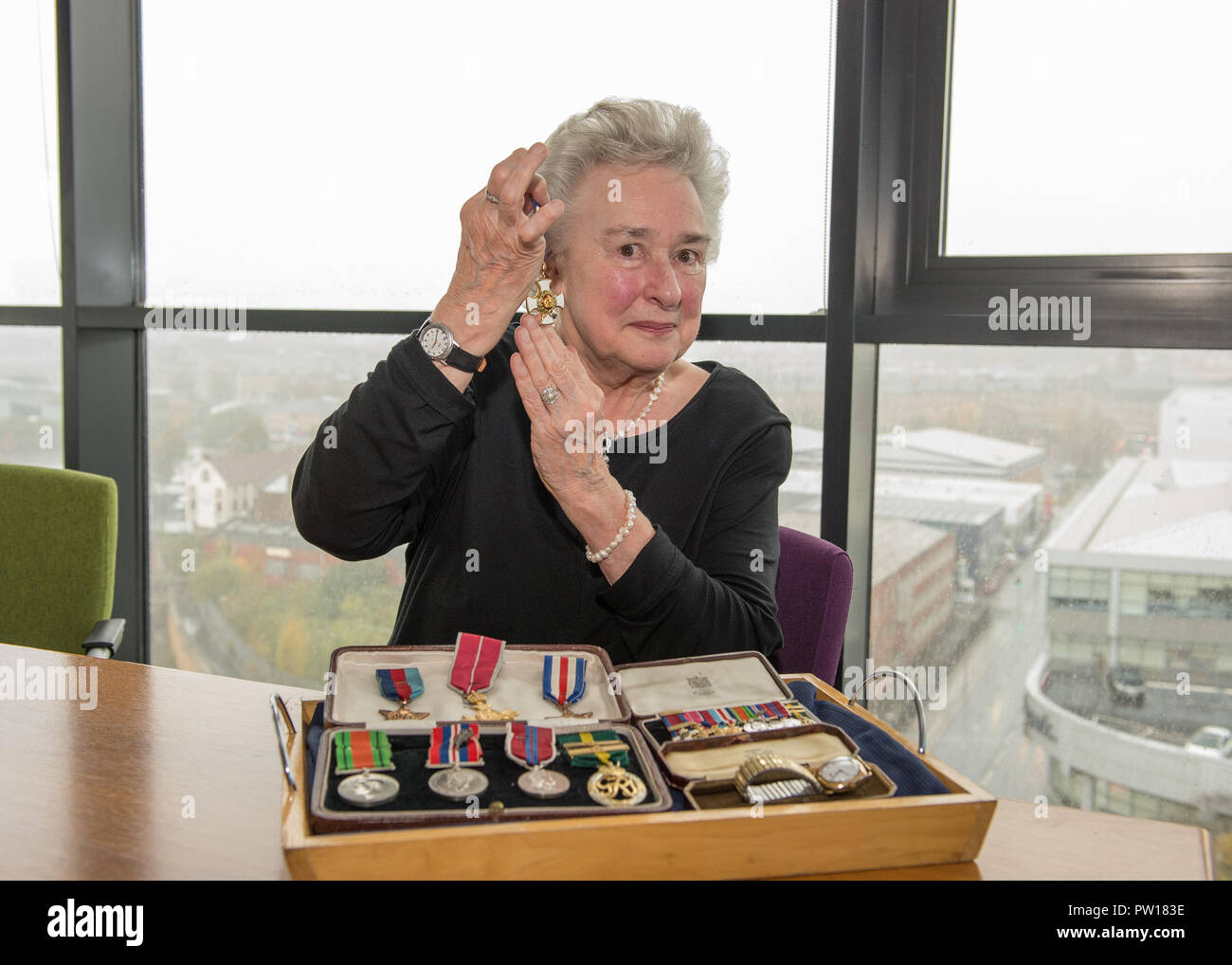 Glasgow, UK. 11th October 2018, Glasgow UK. Second World War Medals being presented to veteran's niece after going missing for decades. The Medals of Colonel William I French of the Glasgow highlanders were found in a safe of a Glasgow accountants four years ago, French Duncan.   Helen Woods (James Alexander French's grandaughter) presented with the medals. Credit: Colin Fisher/Alamy Live News Stock Photo