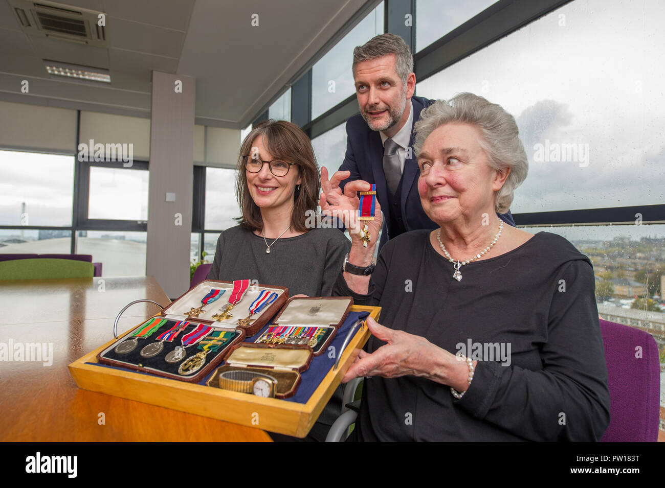 Glasgow, UK. 11th October 2018, Glasgow UK. Second World War Medals being presented to veteran's niece after going missing for decades. The Medals of Colonel William I French of the Glasgow highlanders were found in a safe of a Glasgow accountants four years ago, French Duncan. Helen Woods (James Alexander French's grandaughter) presented with the medals. Credit: Colin Fisher/Alamy Live News Stock Photo