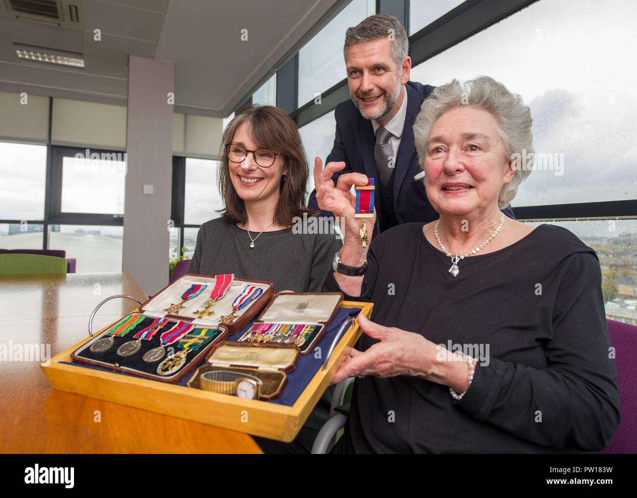 Glasgow, UK. 11th October 2018, Glasgow UK. Second World War Medals being presented to veteran's niece after going missing for decades. The Medals of Colonel William I French of the Glasgow highlanders were found in a safe of a Glasgow accountants four years ago, French Duncan.   Helen Woods (James Alexander French's grandaughter) presented with the medals. Credit: Colin Fisher/Alamy Live News Stock Photo
