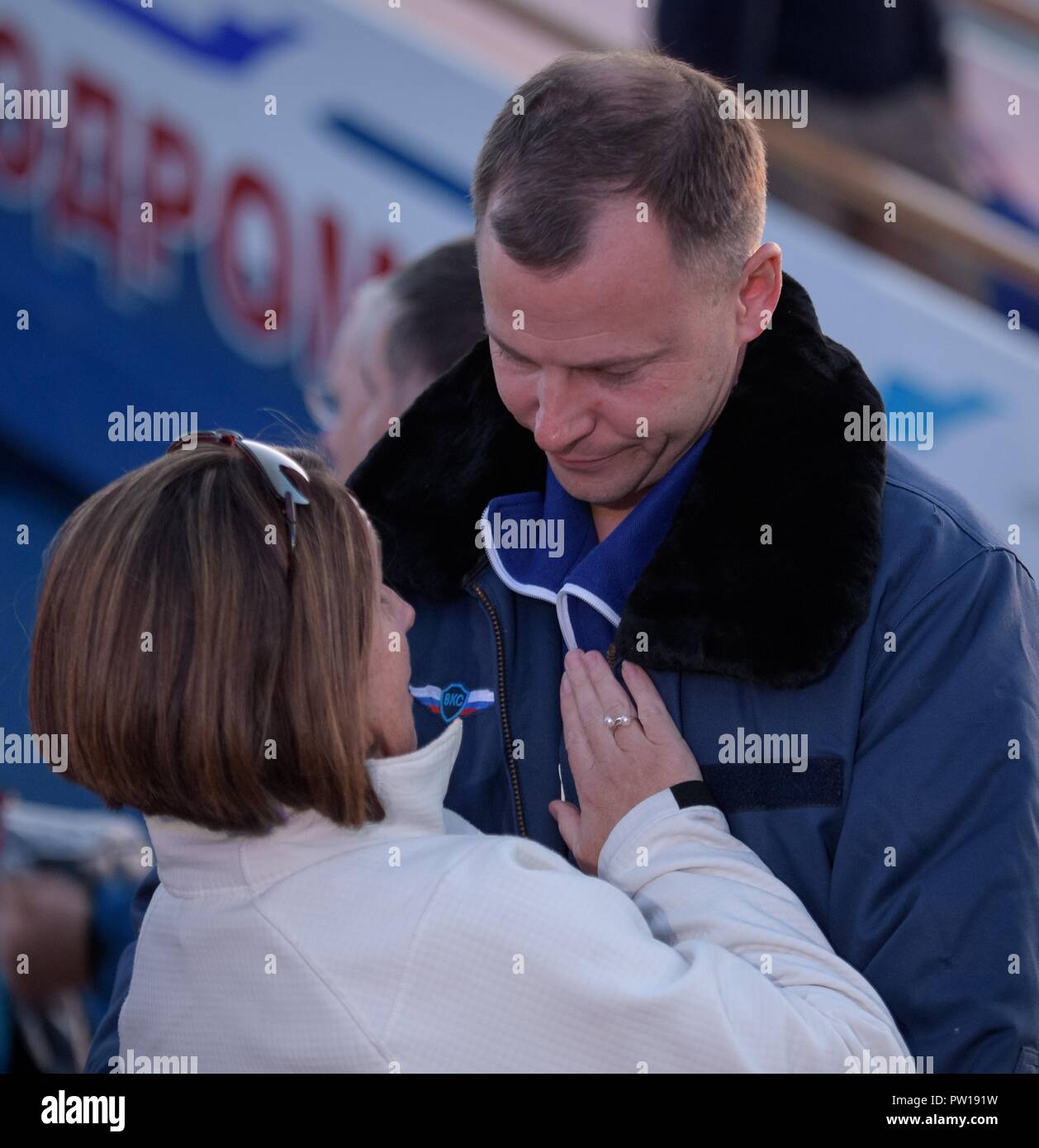 International Space Station Expedition 57 Flight Engineer Nick Hague of NASA, embraces his wife Catie after landing at the Krayniy Airport following an abort during liftoff in the Russian Soyuz Rocket October 11, 2018 in Baikonur, Kazakhstan. Shortly after lift off the rocket malfunctioned en route to the International Space Station and aborted forcing an emergency landing in Kazakhstan. Stock Photo