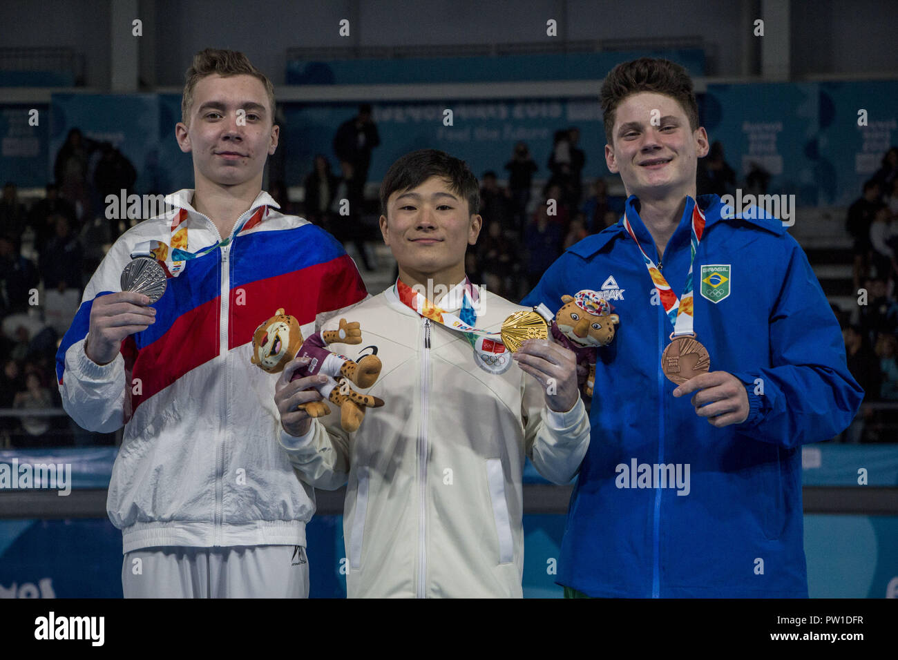 Buenos Aires, Buenos Aires, Argentina. 11th Oct, 2018. Final Award of Artistic Gymnastics Male Multiple Competition in the Youth Olympic Games Buenos Aires 2018. Gold Medal for Kitazono Takeru of Japan, Silver Medal for Naidin Sergei of Russia and Bronze Medal for Soares Diogo of Brazil. Credit: Roberto Almeida Aveledo/ZUMA Wire/Alamy Live News Stock Photo