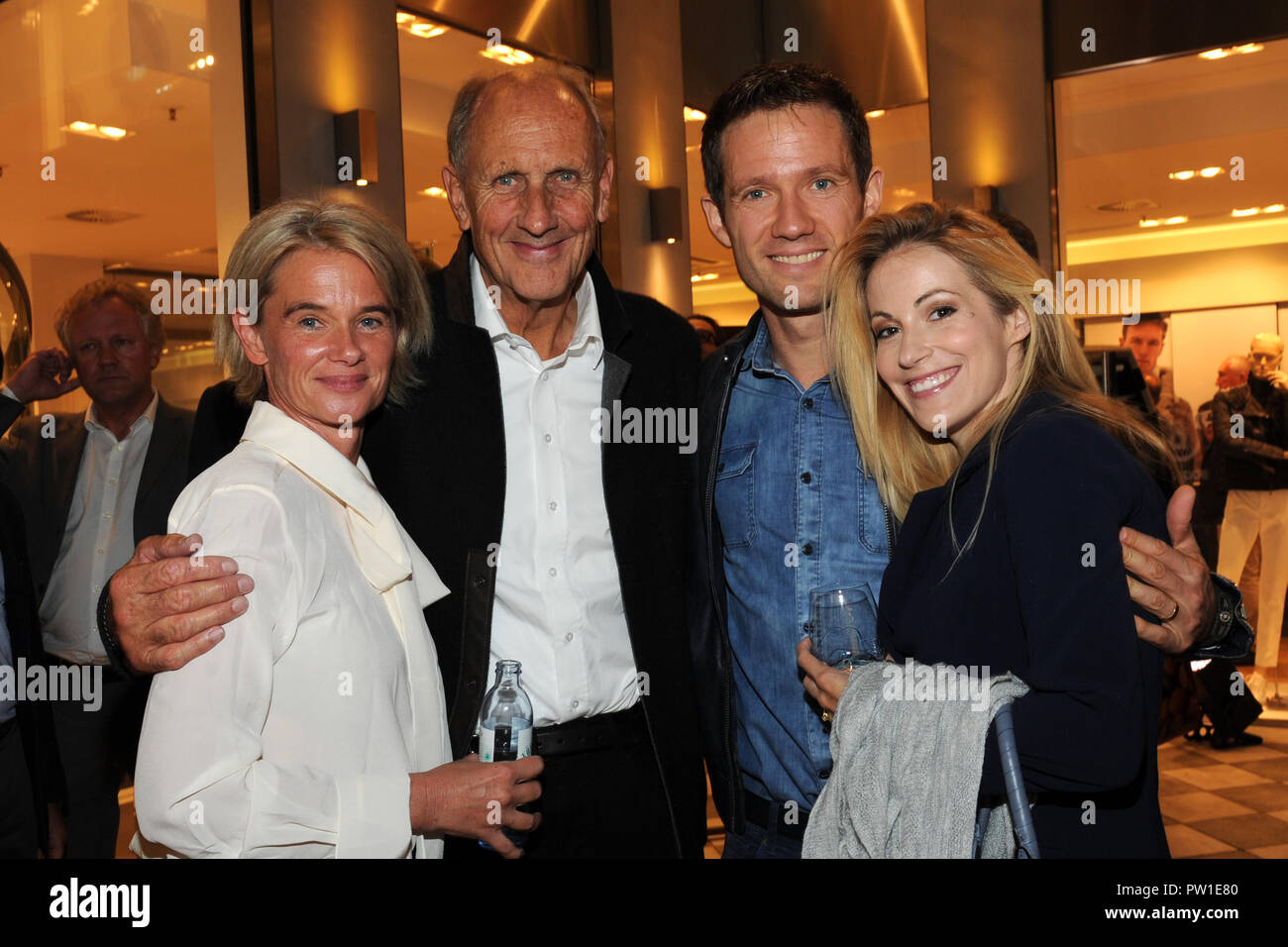 Munich, Bavaria. 11th Oct, 2018. Formula 1 racer Joachim Stuck (2nd from left), his wife Uschi (L) and presenter Andrea Kaiser with husband, the former rally driver Sebastian Ogier, arriving to the cocktail party on the occasion of the presentation of the Bogner winter collection 2018/19 in the Bogner Haus in the Residenzstrasse. Credit: Ursula Düren/dpa/Alamy Live News Stock Photo