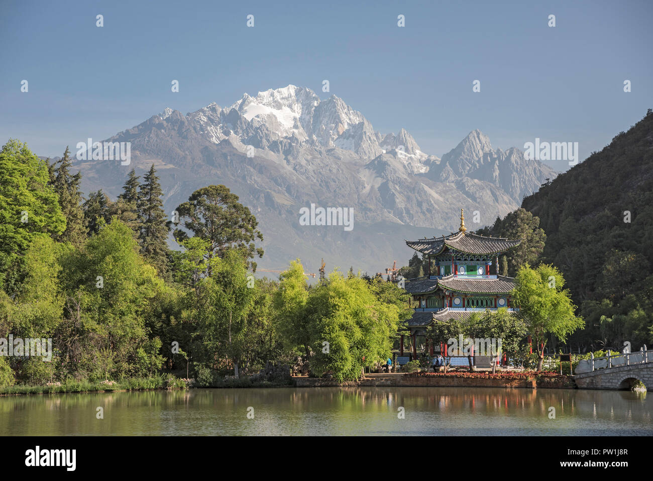 Looking across the Black Dragon Pool towards the Jade Dragon Snow Mountains of South West China Kunming. Stock Photo