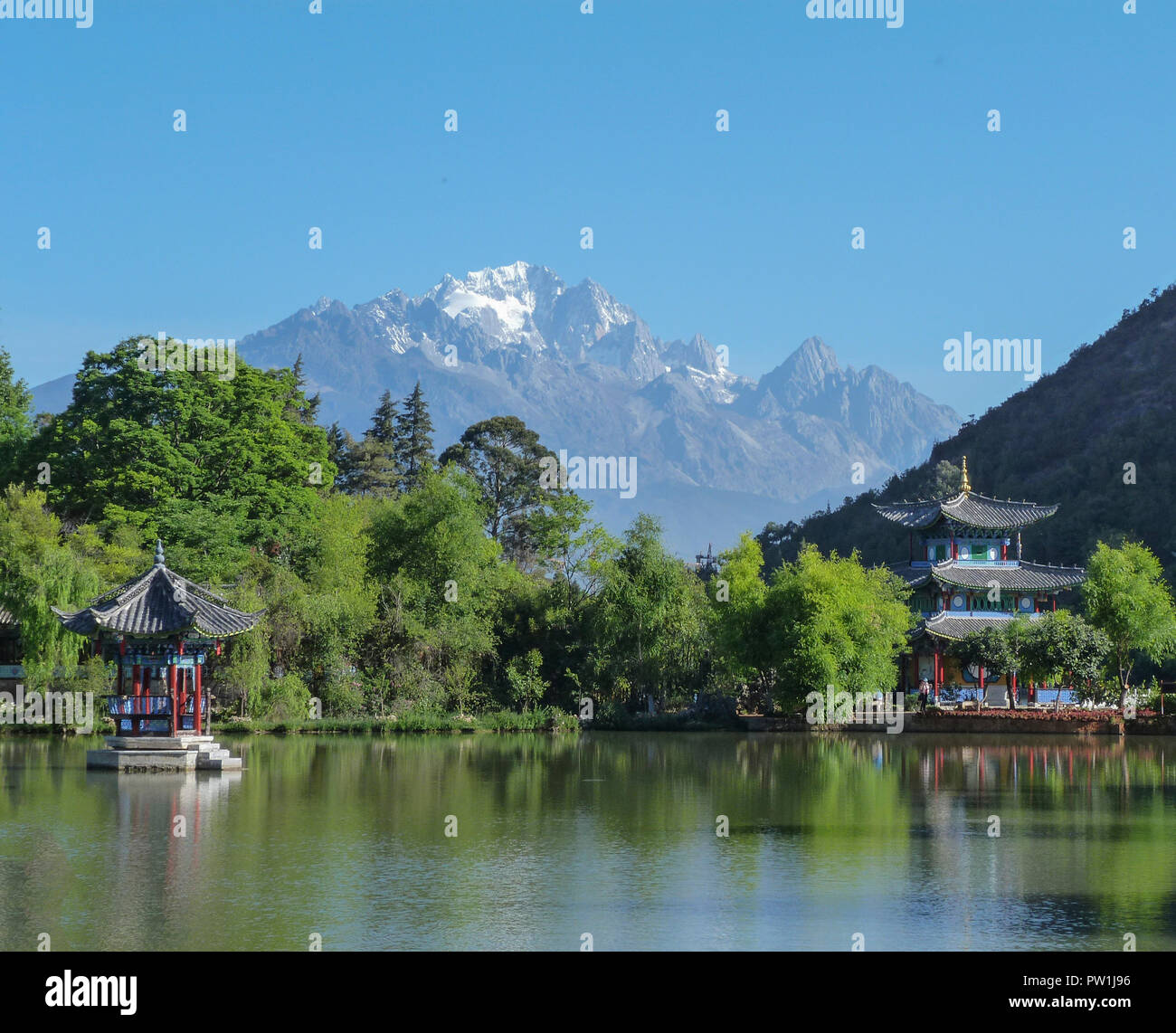 Black Dragon Pool towards the Jade Dragon Snow Mountains of South West China Kunming. Stock Photo