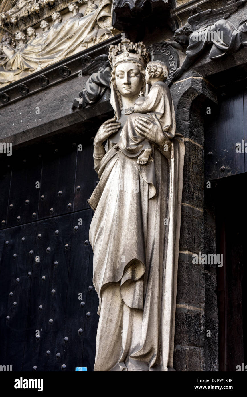 A white statue of maddona and baby on a wall in Sint-Janshospitaal Brugge, Belgium, Europe on a bright sunny  day Stock Photo