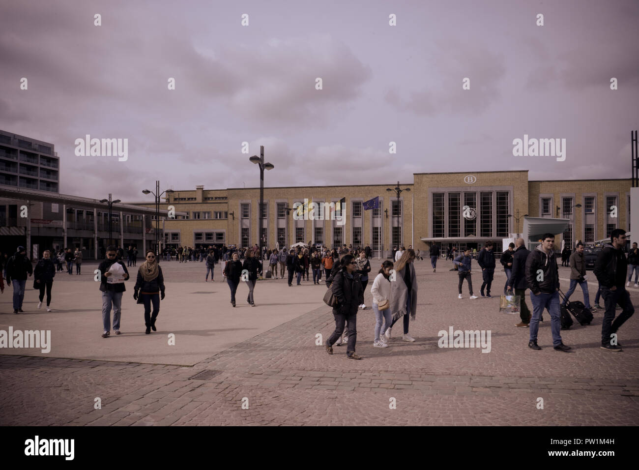 Brugge, Belgium - April 17 : The Brugge railway station on June 17, 2017. People walk in front of the railway station on a cloudy morning Stock Photo