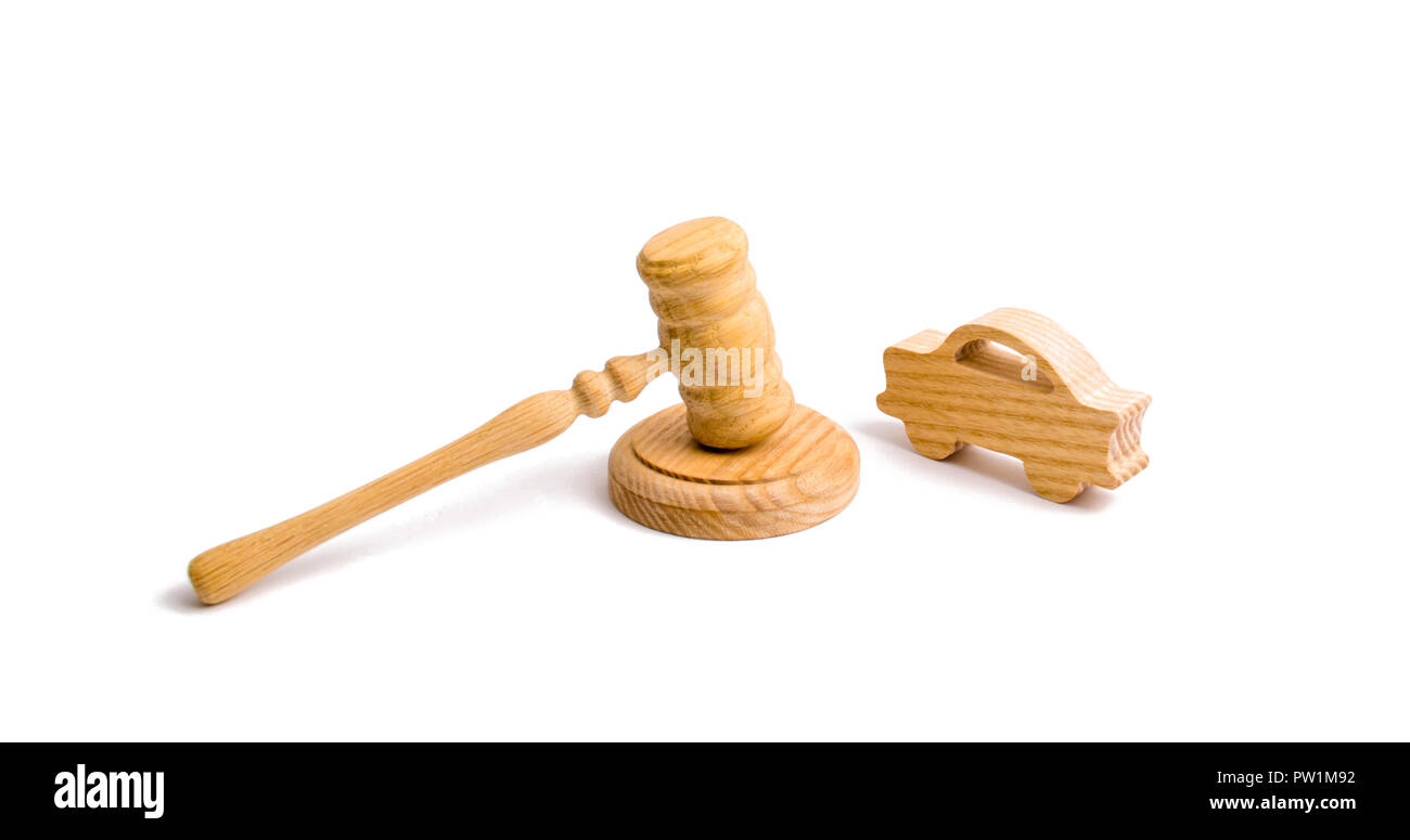 Wooden figurine of a car with a hammer of the judge on a white background. Minimalism. Purchase and sale of the car. The trial, confiscation of the ma Stock Photo